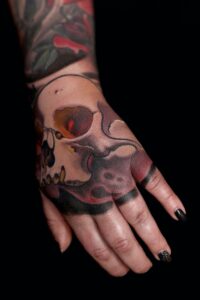 skull on hand tattoo